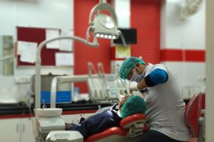 [freepicdownloader.com]-dentist-checking-patient-normal